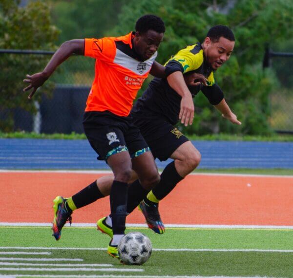 2025 BAS Cup Action : 905 FC shields the ball from Ebony