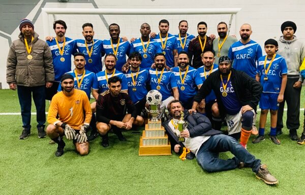 GNFC continue adding titles to their participation in soccer in Brampton as they pose with the Masters championship trophy.