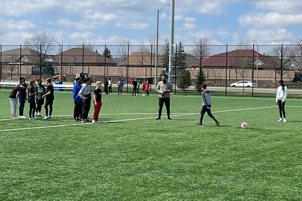 Young Ontario Soccer members learning 'Penalty Set-Up' as referees for their Small Sided Game Certification